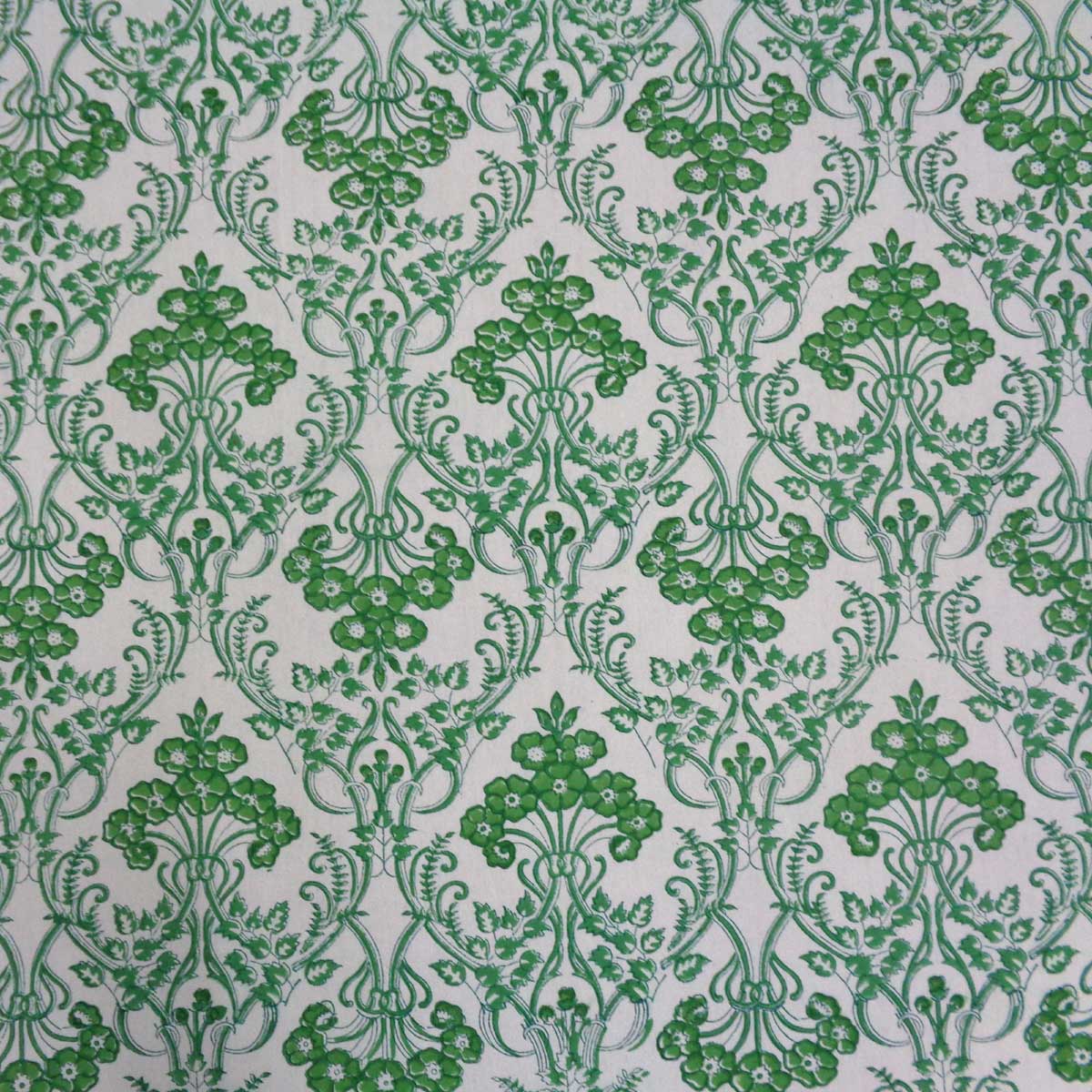 Close up of green floral damask style floral pattern hand block printed on premium cotton