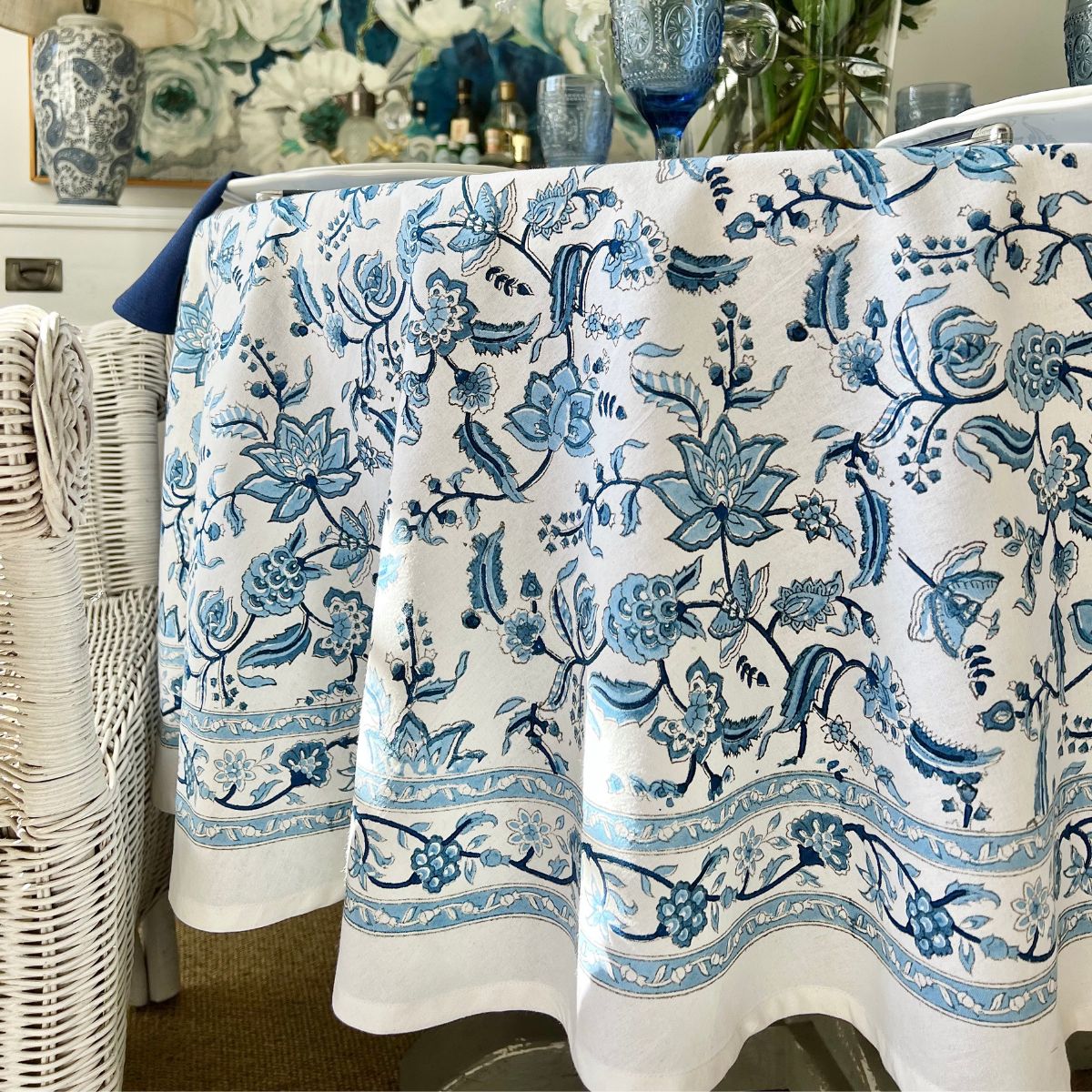 Side view of 180 cm Chintz monochrome blue hand block printed round table linen for a 6 seater circular dining table, a bold everyday tablecover in rich blue floral block print on premium cotton.