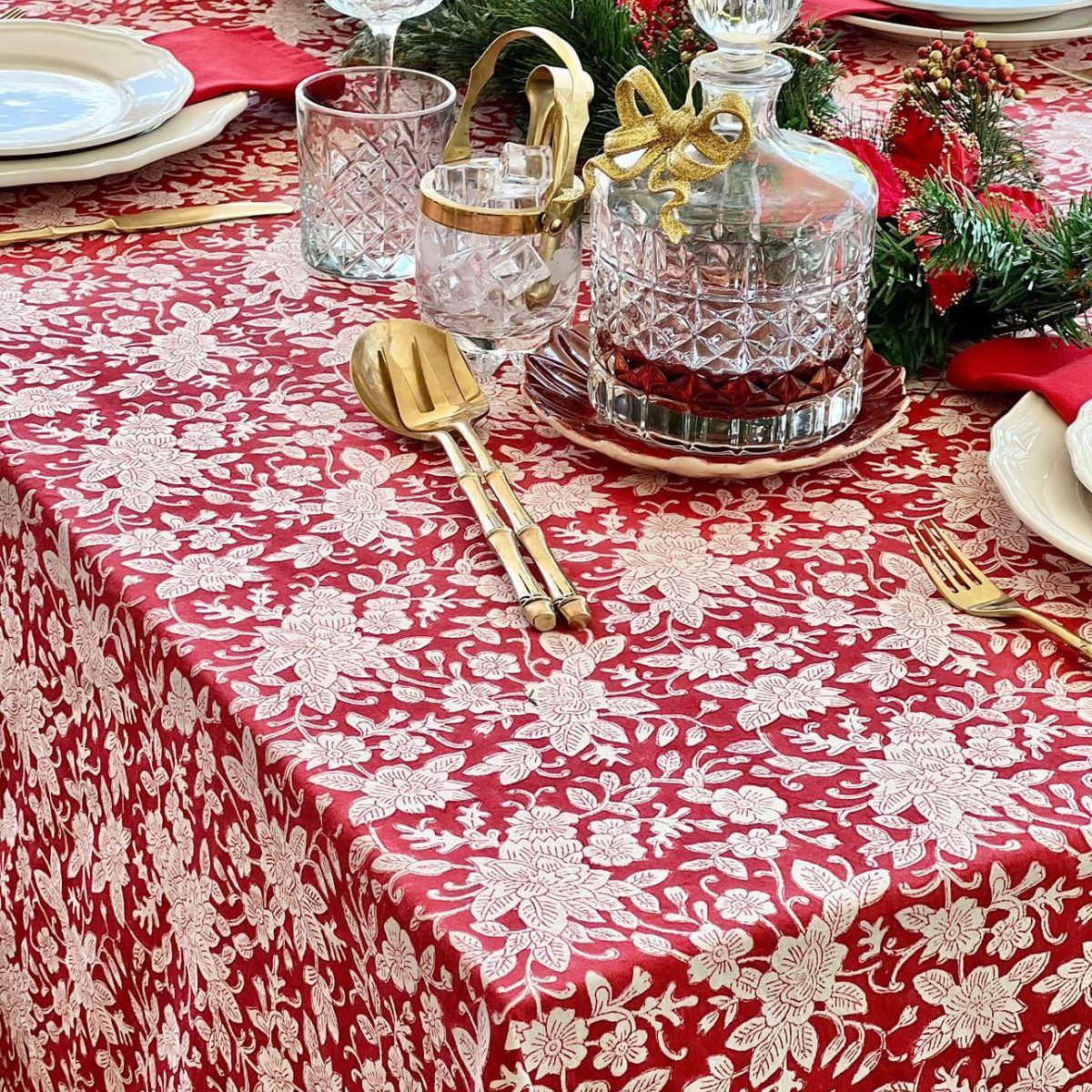 A red and white floral hand block printed cotton tablecloth for an 8 to 10 seater table, a bold festive dining linen for Australian holiday entertaining
