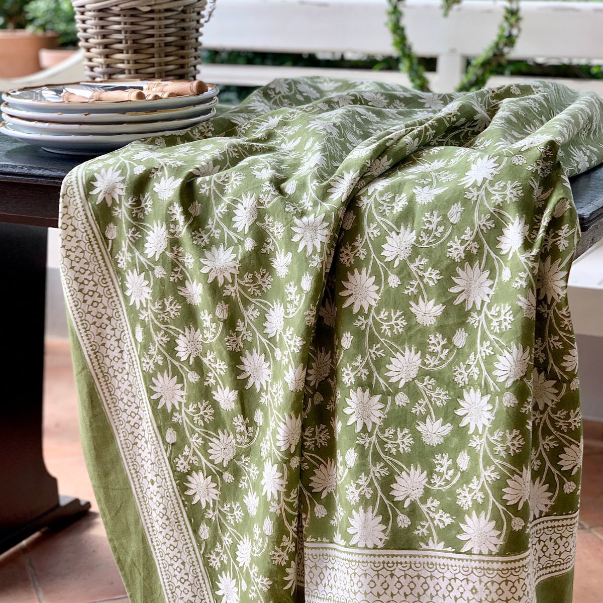 Australian native flannel flower hand block printed on premium cotton fabric displayed on large square table.