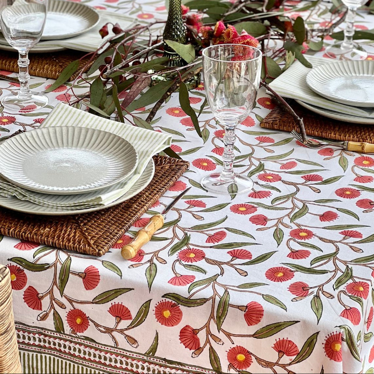 Hand block printed 180 x 340 cm rectangular tablecloth featuring Australian native red gums floral pattern on cotton.