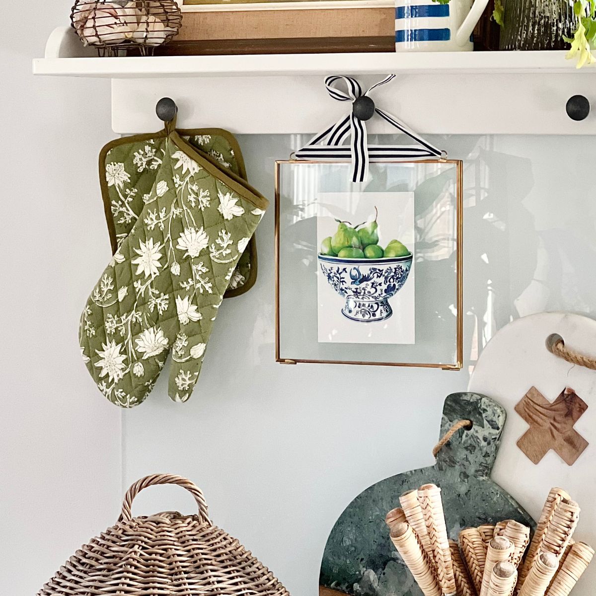 Australian flannel flower quilted oven mitt hanging in a kitchen, adding decorative botanical charm while remaining practical for everyday cooking.