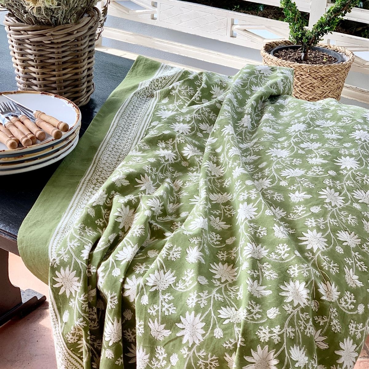 180 cm Flannel Flowers tablecloth draped over a square dining table, highlighting the premium cotton fabric, weight, and elegant flow.