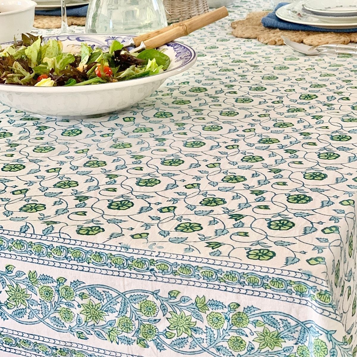 Hand block printed blue and green floral pattern on cotton square tablecloth