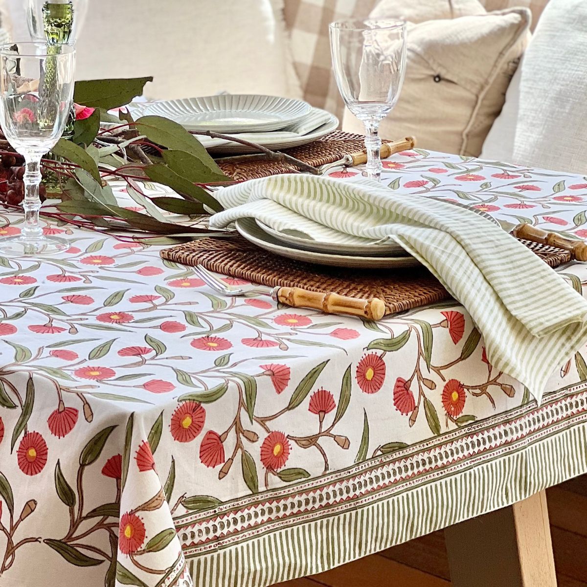 Hand block printed square tablecloth featuring Australian native red gums floral pattern on cotton.