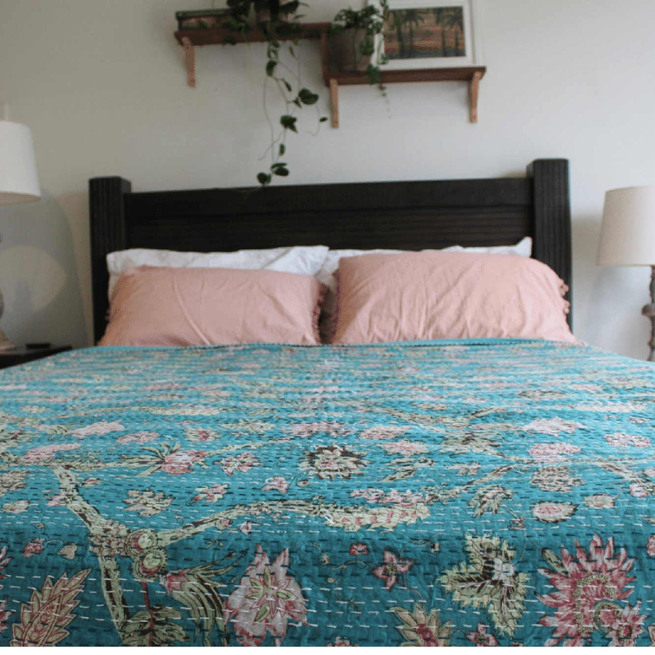 Bed with floral bedding in a bedroom setting