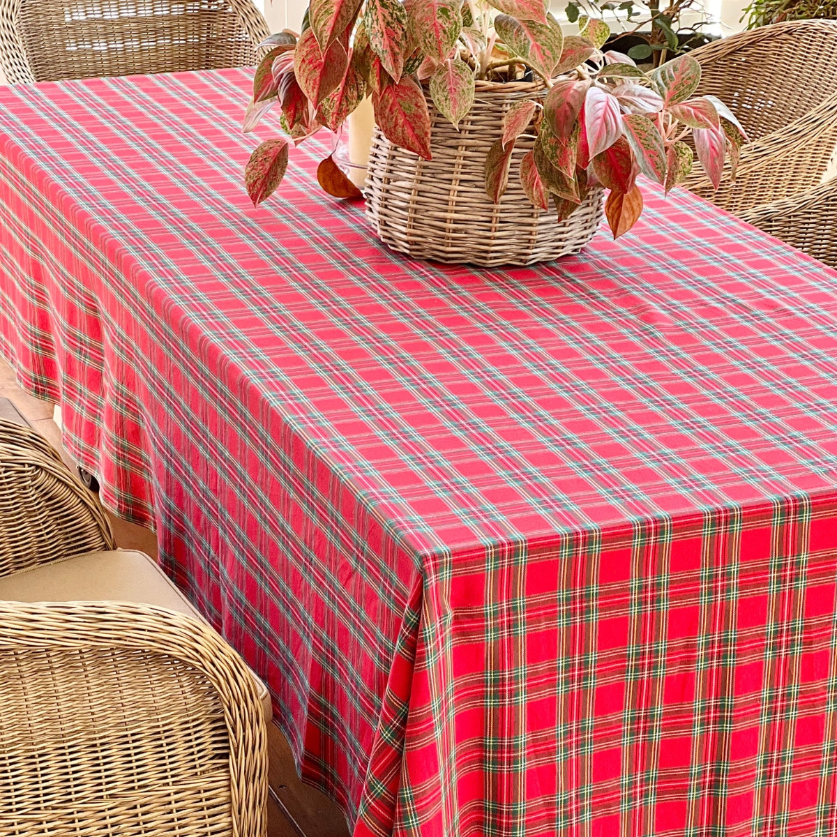 Red Green Tartan Handwoven tablecloth on large rectangular table in an alfreso setting