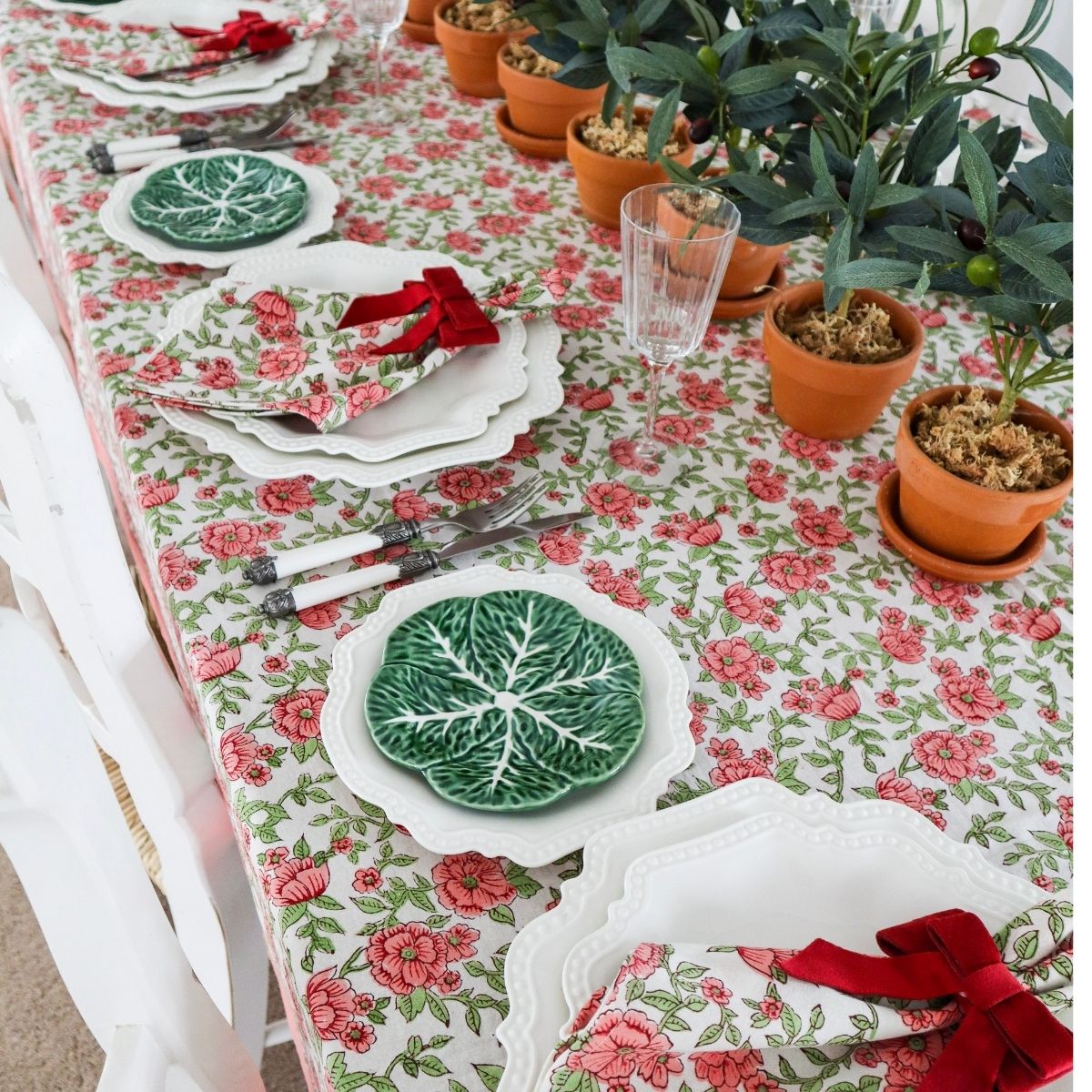 Close up of Block printed cotton floral tablecloth on large rectangular table in festive setting