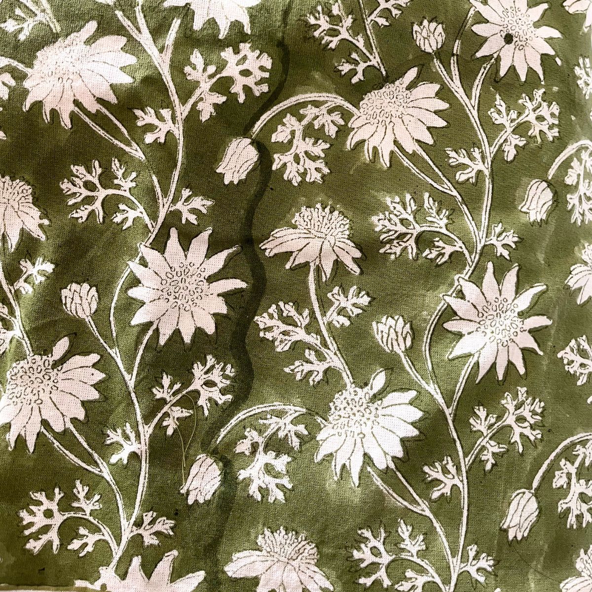 Close-up of the Flannel Flowers cotton fabric highlighting the natural variations and character of authentic hand block printing.