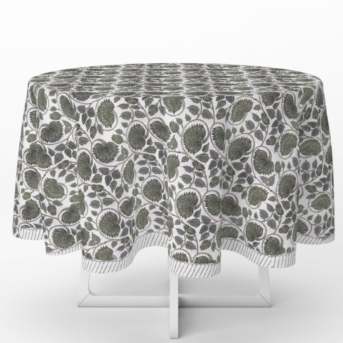 A 180 cm green lotus hand block printed cotton round tablecloth draped on a white table against a clean white background, showing the rich green floral lotus pattern with striped edge.