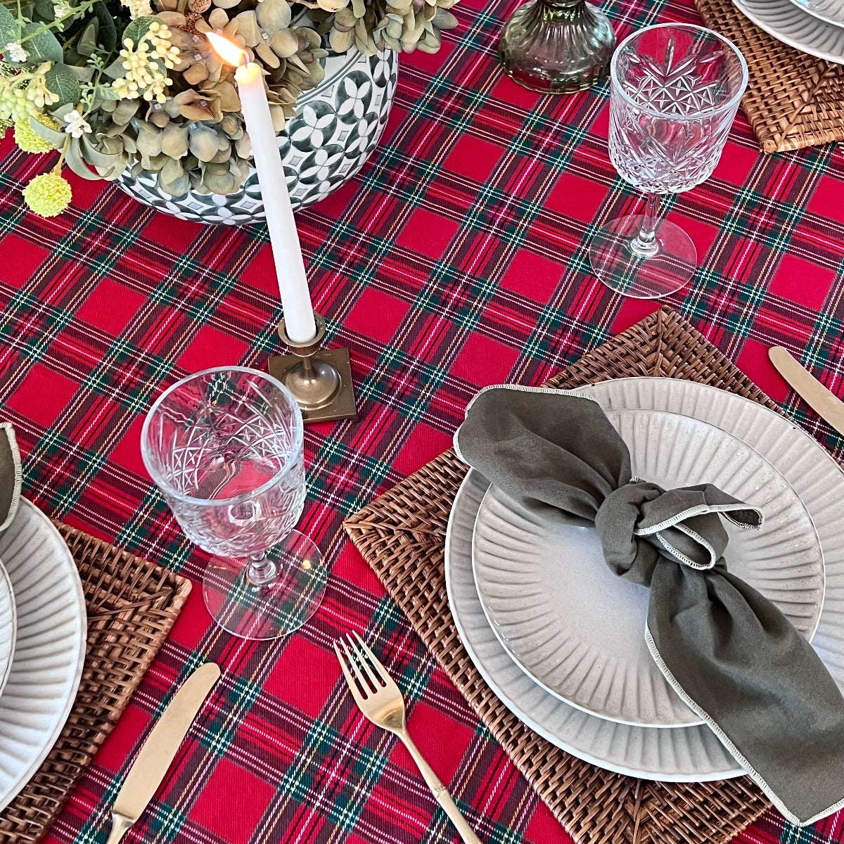 
Close up of red tartan plaid pattern on 100% cotton round tablecloth showing woven check detail