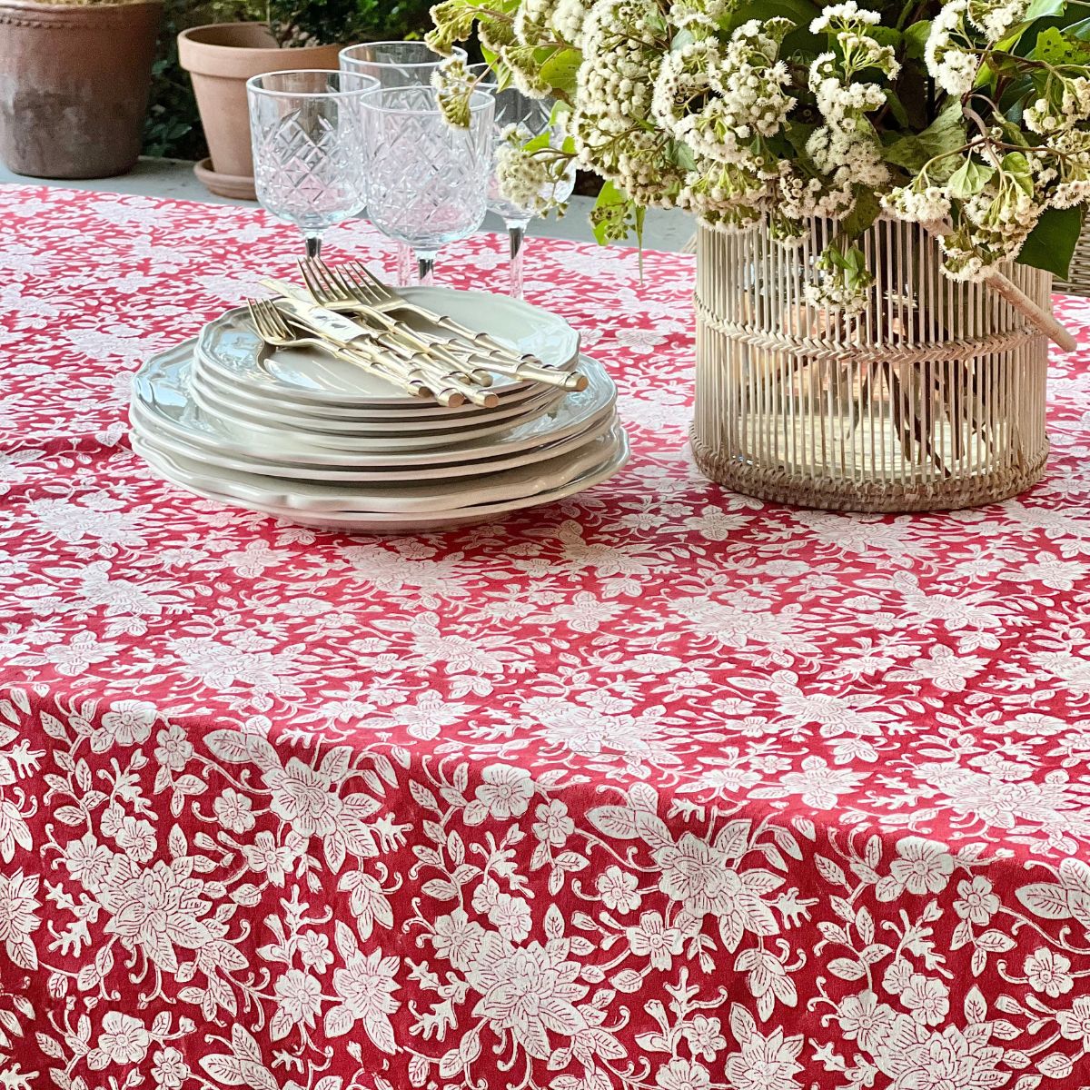 A 153 x 305 cm red and white floral hand block printed table linen for a generous dining table, a bold everyday tablecover for relaxed informal Australian dining.