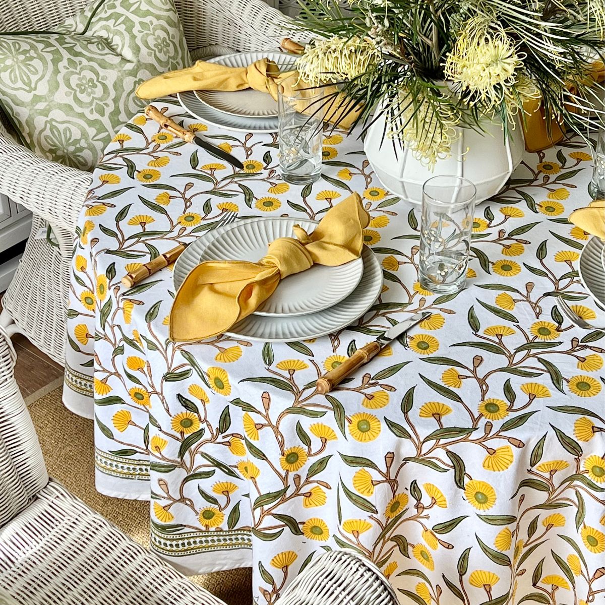220 cm Yellow Flowering Gums round tablecloth creating a welcoming indoor brunch setting with coordinated tableware.