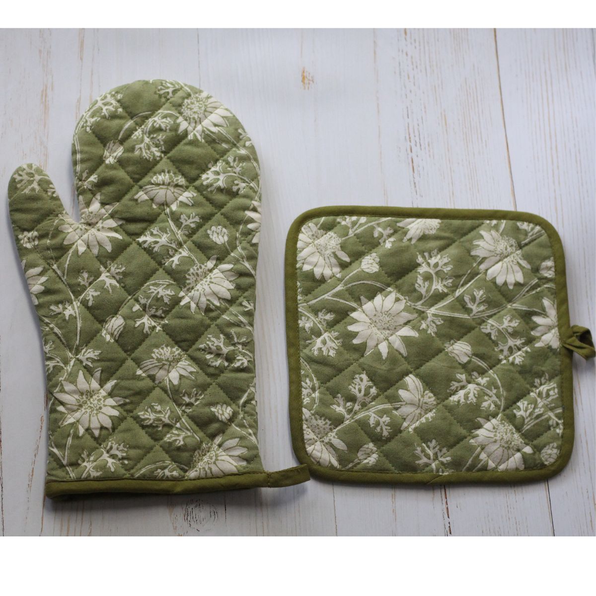 Quilted Flannel Flowers oven mitt displayed on a neutral background, featuring hand block printed floral motifs and protective cotton construction.