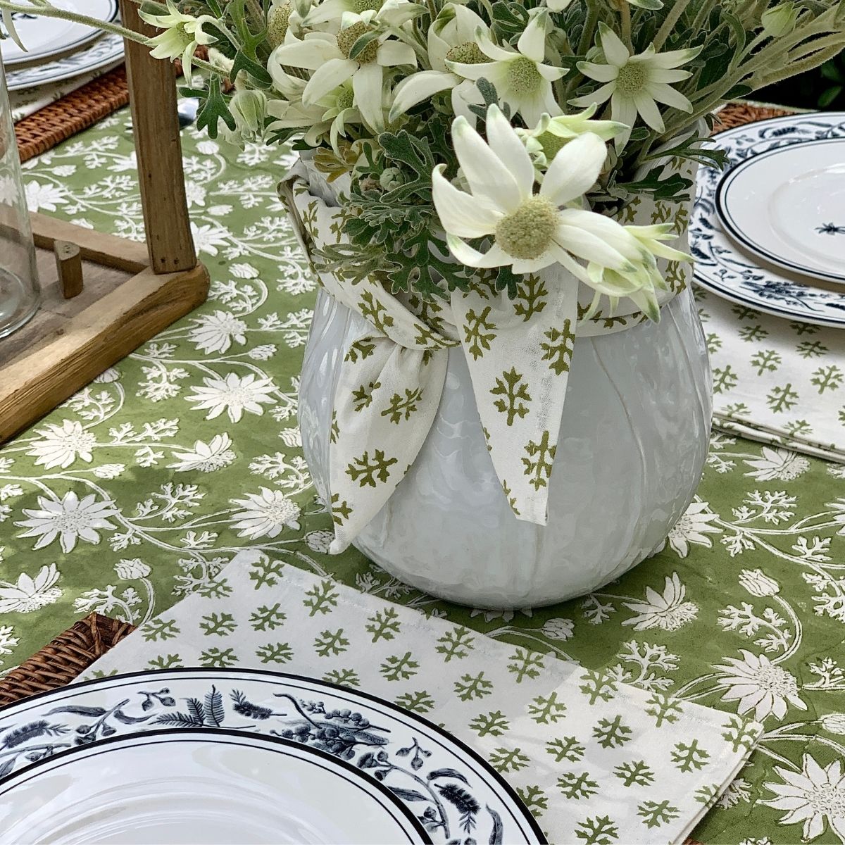 
Flannel leaf napkin and fresh floral centerpiece styled on the Flannel Flowers tablecloth, showcasing the coordinated botanical Australian design 