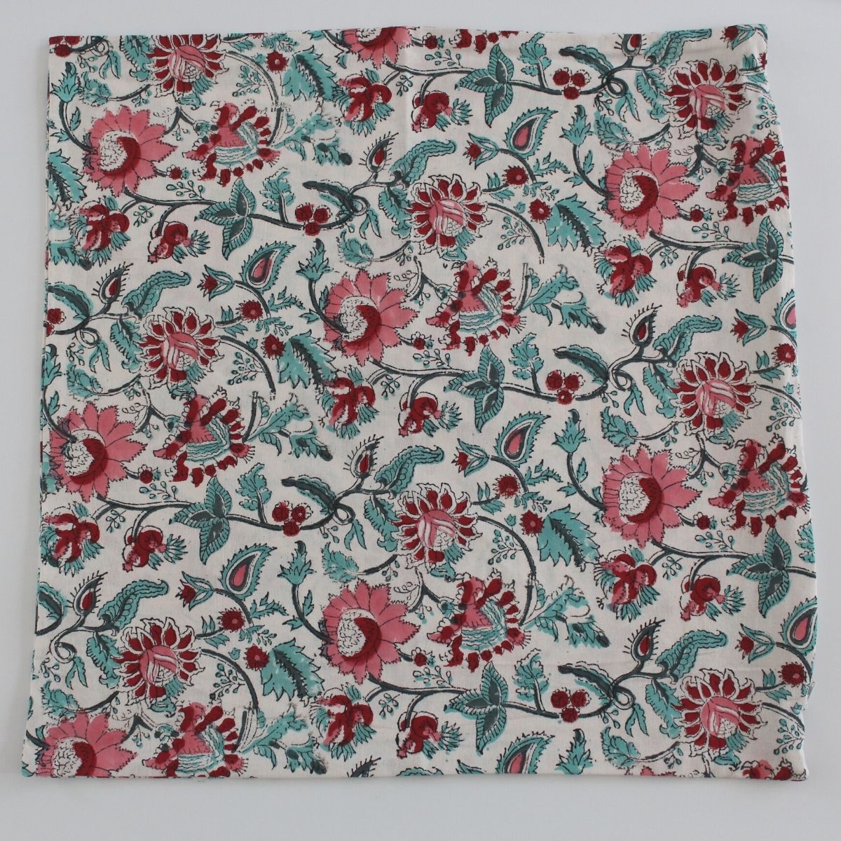 
Flat lay of a Pink Blue Floral hand block printed cushion cover crafted from pure cotton, highlighting the floral pattern, soft texture, and premium finish.