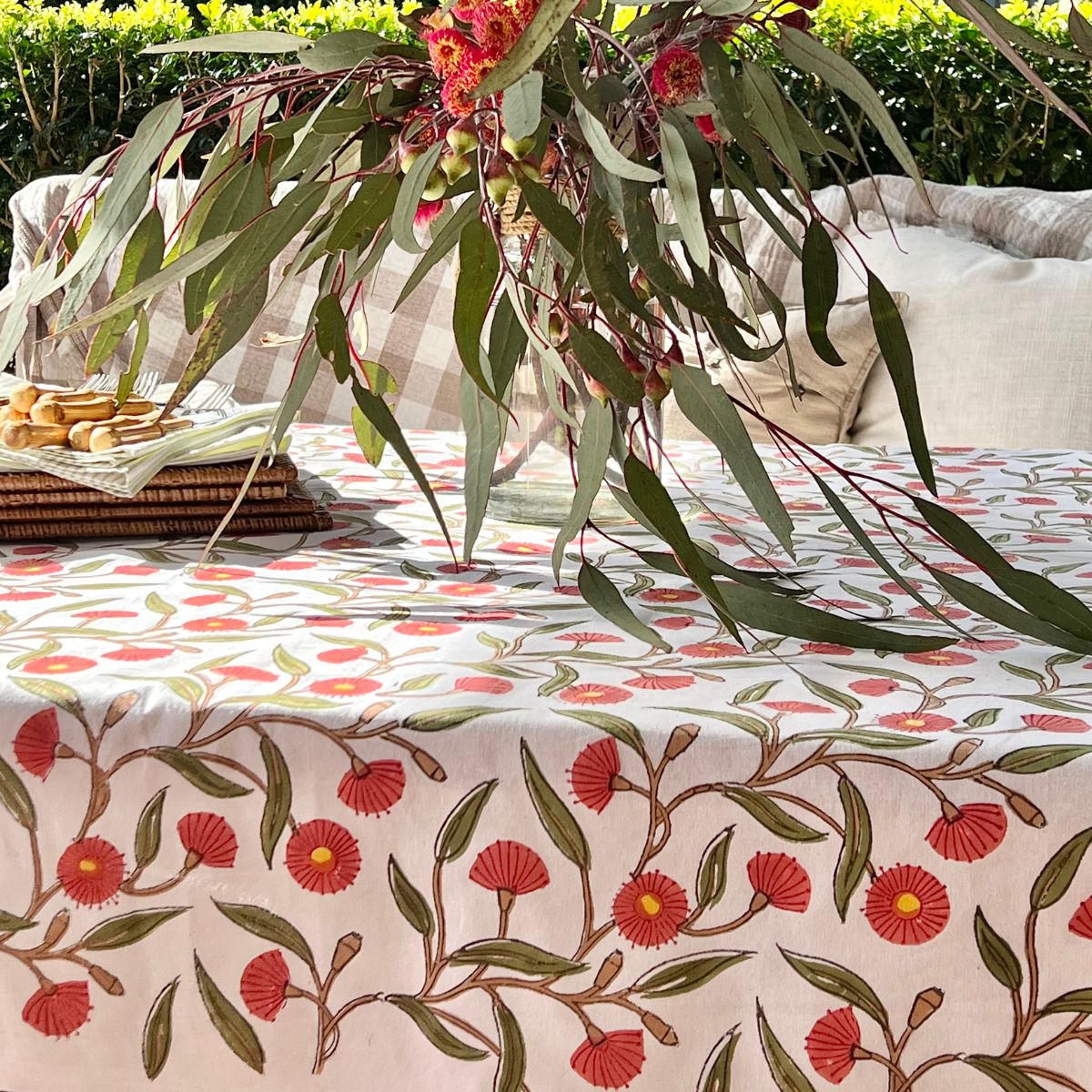 180 x 270 cm Red Flowering Gums tablecloth styled outdoors for an 8 to 10-seater spring and summer al fresco gathering.