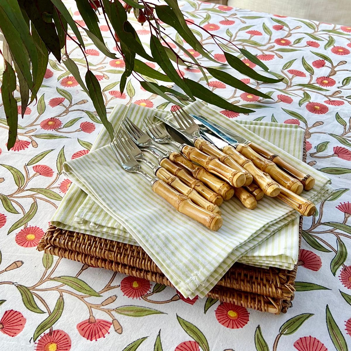 180 x 300 cm Red Flowering Gums cotton tablecloth for a 10-seater weekend brunch with coordinated napkins and white dinnerware.